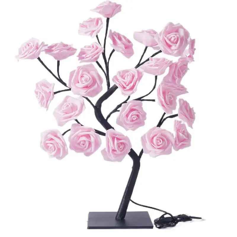LED table lamp shaped like a tree with pink rose flowers, black stand, white background
