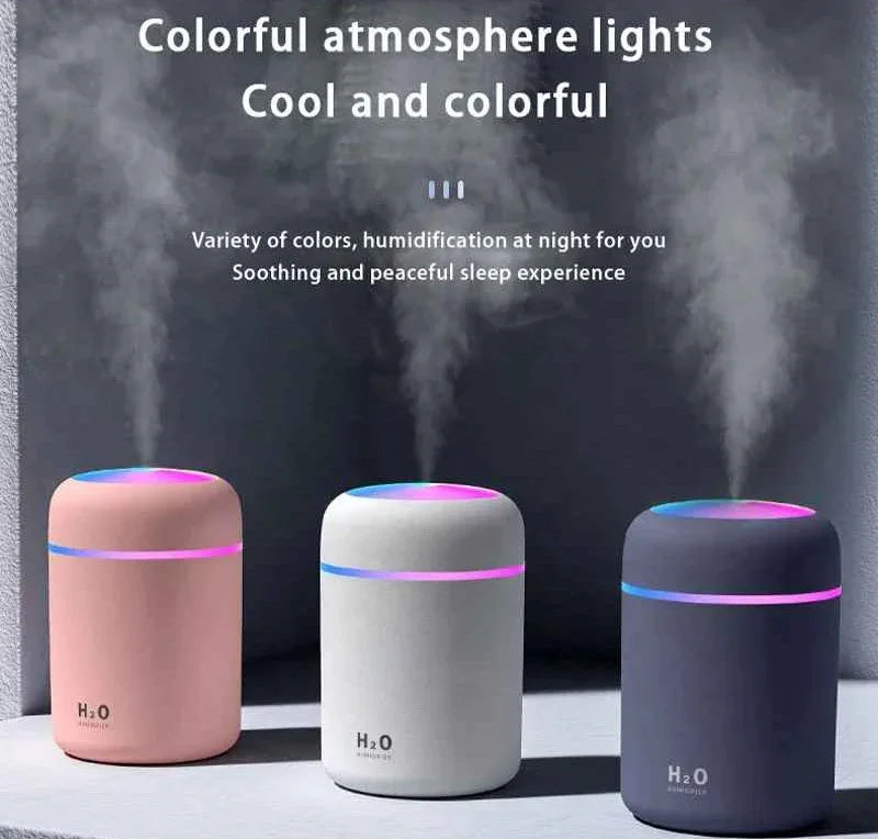 Three colorful H2O humidifiers with LED lights releasing mist, promoting peaceful sleep.
