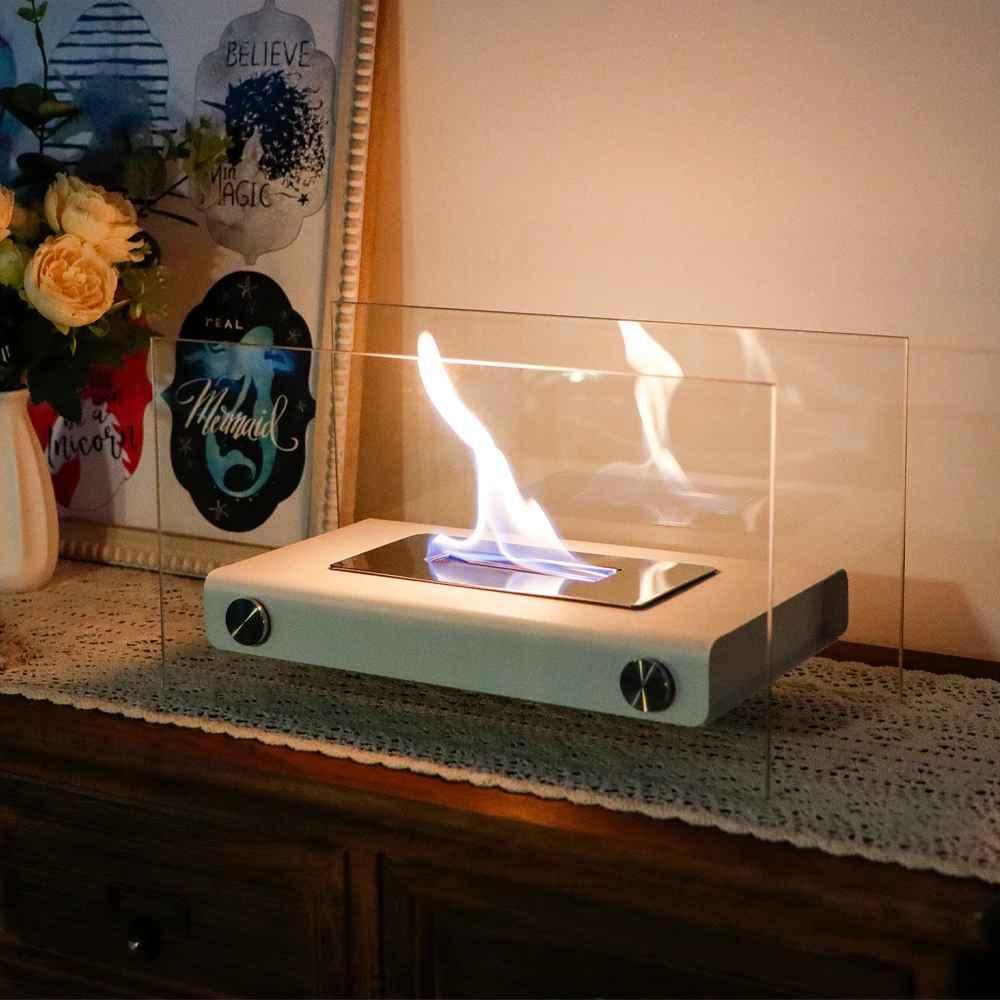 Modern tabletop ethanol fireplace with glass panels on a wooden cabinet, home decor