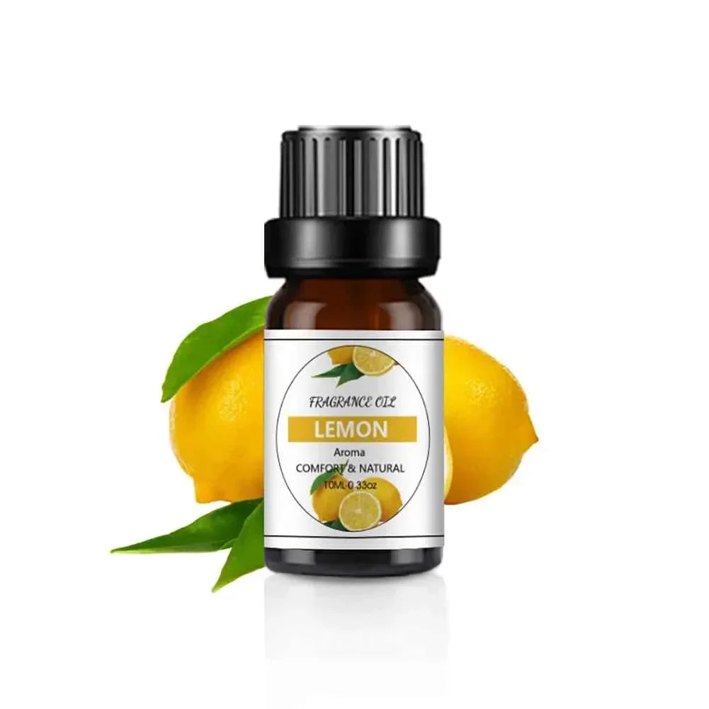Lemon fragrance oil bottle with fresh lemons and green leaves on white background
