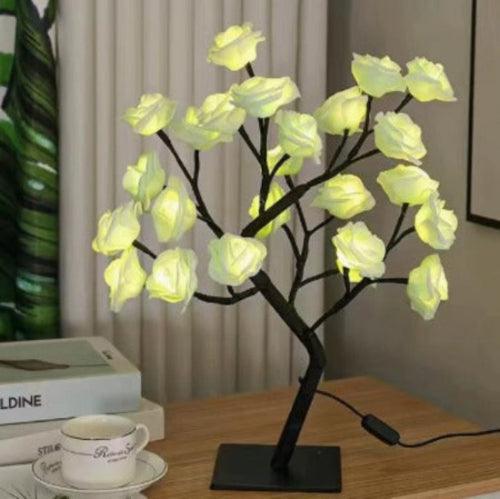LED rose flower lamp on wooden desk in modern bedroom setting