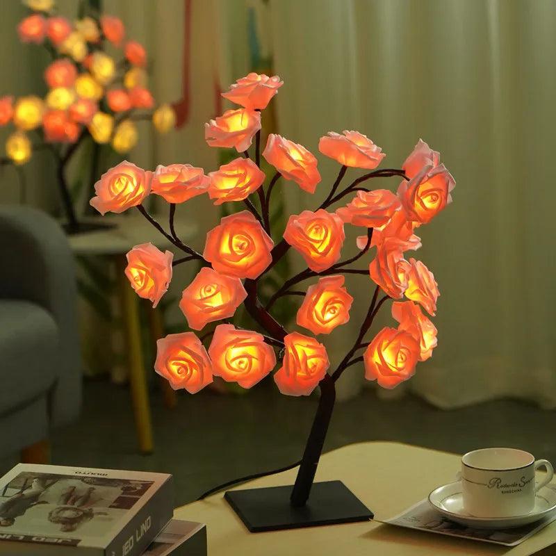 Rose flower LED table lamp glowing on a side table in a cozy living room setting