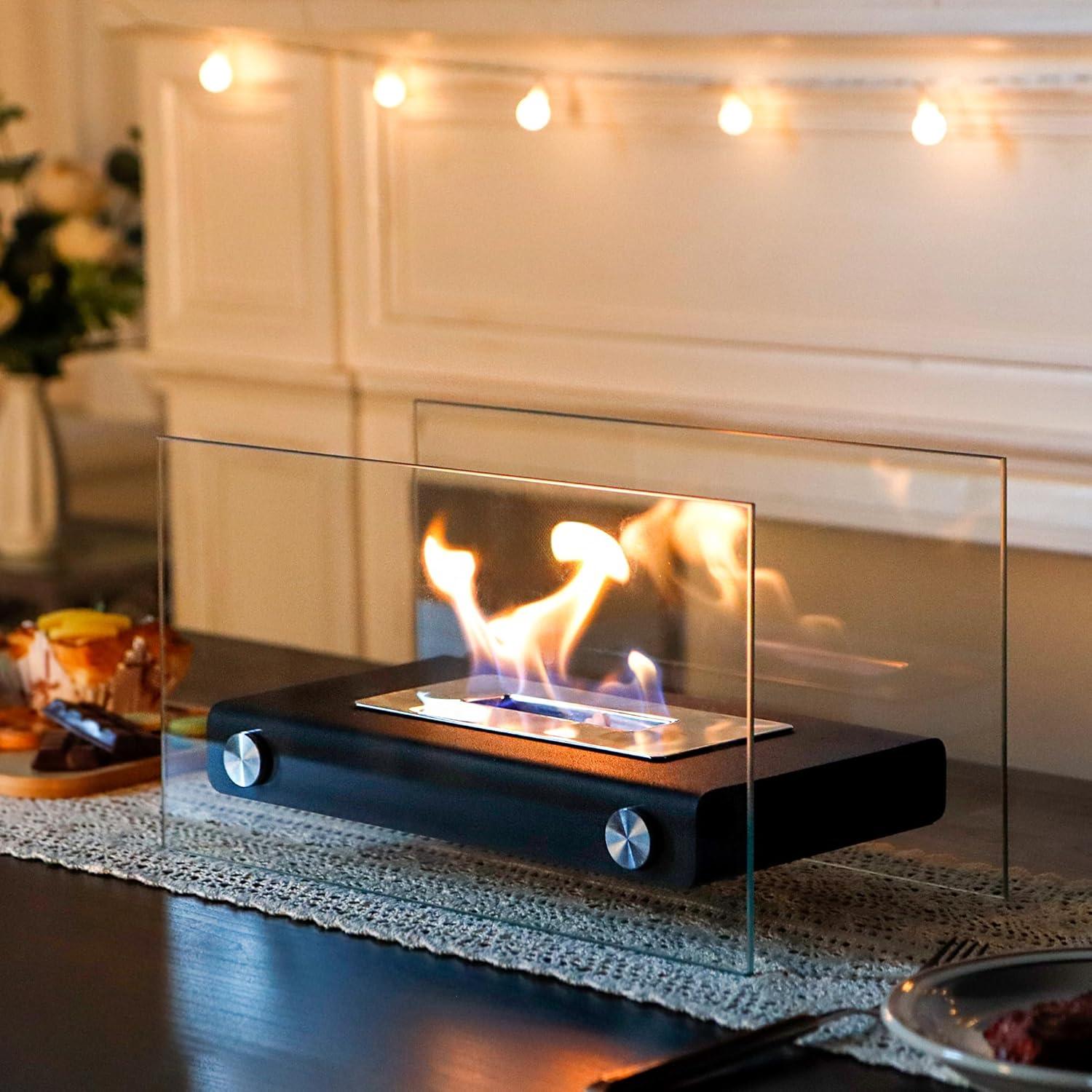Modern tabletop glass ethanol fireplace on a dining table, cozy indoor decor with warm lights