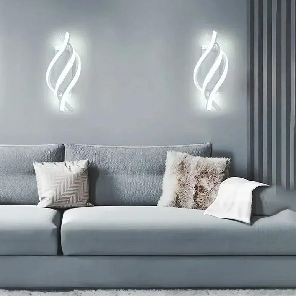 Modern living room with gray sofa, plush pillows, and LED spiral wall sconces