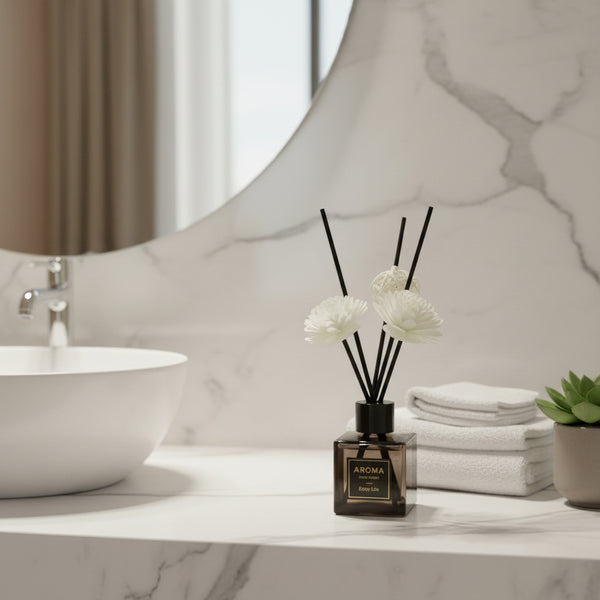 Aroma diffuser with white flowers on a bathroom counter.